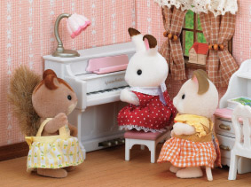 3 Sylvanians in a corner of a room, with one playing piano while the others watch